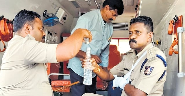 An injured policeman avails treatment in an ambulance at Hattargi Toll Gate.