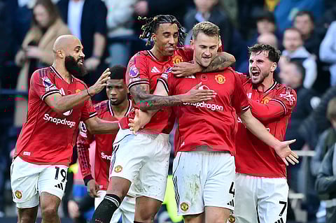 Manchester United's Dutch defender Matthijs de Ligt celebrates with teammates after scoring their late second goal during the English Premier League match against Tottenham Hotspur (Photo | AFP)