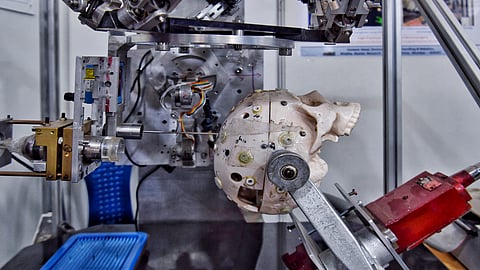 A prototype of a robot developed by BARC and used in neurosurgery procedures is seen on display at an annual exhibition at NIMHANS in Bangalore.