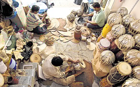 Inside a modest shop filled with half-tuned tablas and their wooden cousins, the dholaks, a family of craftsmen continues a 180-year-old legacy, repairing rhythm itself.