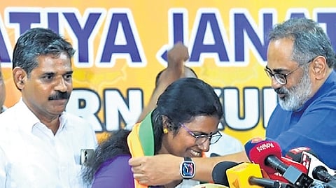 BJP state chief Rajeev Chandrasekhar welcoming councillor Sunitha Dixon, who was earlier with UDF, to the party. District president K S Shaiju looks on