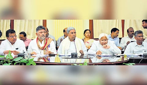 Chief Minister Siddaramaiah, Deputy Chief Minister DK Shivakumar and other ministers at a meeting with sugarcane farmers 
and mill owners at Vidhana Soudha in Bengaluru on Friday.
