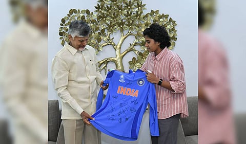 Cricketer Sri Charani presents an Indian jersey signed by all players to Chief Minister N Chandrababu Naidu.