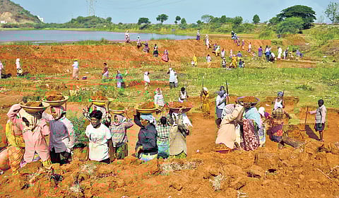 People involved in NREGA work at the outskirts of Vijayawada.