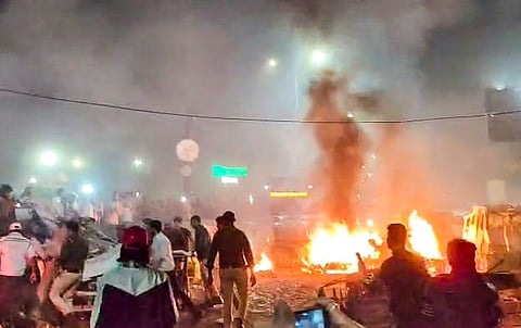 Security officials inspect the scene of a car explosion near the historic Red Fort in New Delhi, India, Monday, Nov. 10, 2025.