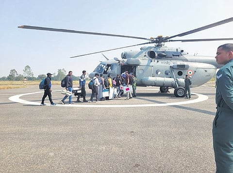 Polling parties boarding a helicopter to reach booths inside Sunabeda sanctuary in Nuapada on Monday.