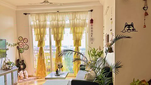 Yellow ruffle curtains adding to the boho-style theme of the space, styled by Stuti Gupta
