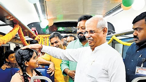 Governor Rajendra Arlekar and Union Minister Suresh Gopi interact with students on board the Vande Bharat.