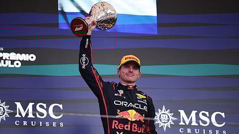 Red Bull driver Max Verstappen of the Netherlands celebrates on the podium his third place during the Brazilian Formula One Grand Prix at the Interlagos race track, in Sao Paulo, Sunday, Nov. 9, 2025. 