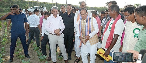 Union minister Shivraj Singh Chouhan interacts with farmers during his visit with dy CM KV Singh Deo, to Rajhansa village in Cuttack district on Monday.