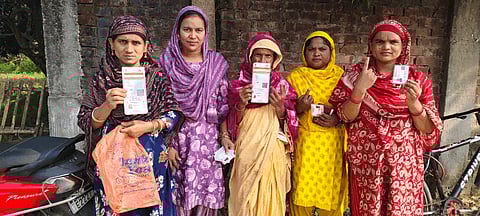 Polling staff collect EVMs and other election materials from a distribution centre before leaving for their respective polling booths on the eve of the second phase of the Bihar assembly election, in East Champaran on Monday. 