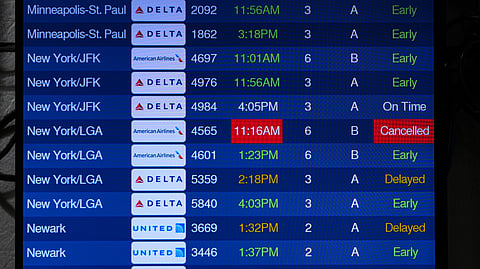The arrivals board shows a cancelled flight from New York at Indianapolis International Airport in Indianapolis, Monday, Nov. 10, 2025.