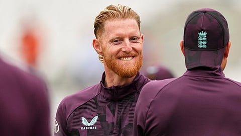 England's Ben Stokes smiles during warm up on day one of the fifth cricket test match between England and India at The Kia Oval in London on July 31, 2025.