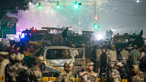 New Delhi: Security personnel at the spot after a blast occurred in a parked car near Red Fort, leaving multiple vehicles in flames, in New Delhi, Monday, Nov. 10, 2025. At least eight people were killed and 24 others suffered injuries in the incident.