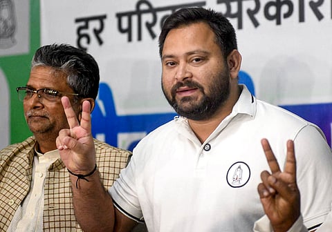 Voters show their ID cards at a polling station during the second and final phase of the Bihar Assembly elections, in Jehanabad, Tuesday, Nov. 11, 2025.