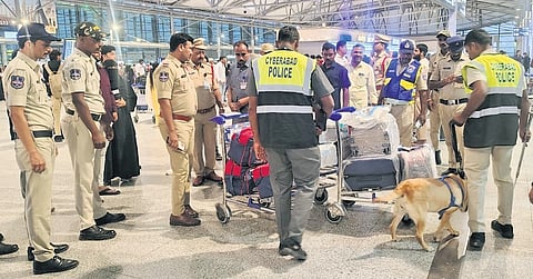 Police check the baggage of passengers at RGIA on Wednesday