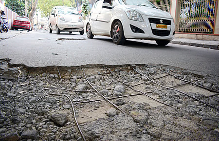 Damaged road used for representational purposes only.