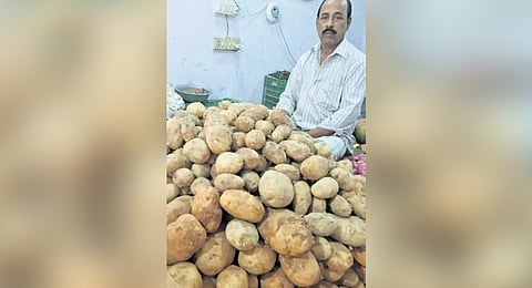A man selling potatoes in Kendrapara district.