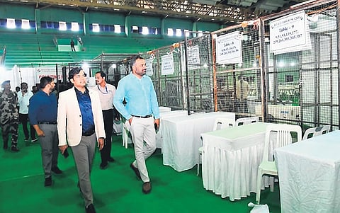 District Election Officer RV Karnan and other officials inspect arrangements at the Kotla Vijayabhaskar Reddy Indoor Stadium, Yousufguda, Hyderabad on Thursday