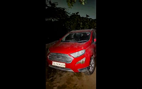 In this image received on Nov. 12, 2025, a red Ford EcoSport car, suspected to be linked to the Delhi Red Fort blast case, after being seized from Khandawali, in Faridabad district, Haryana.