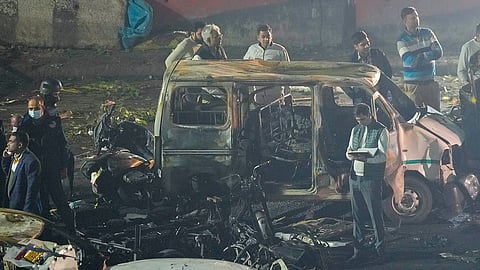 Security personnel at the spot after a blast occurred in a parked car near Red Fort.