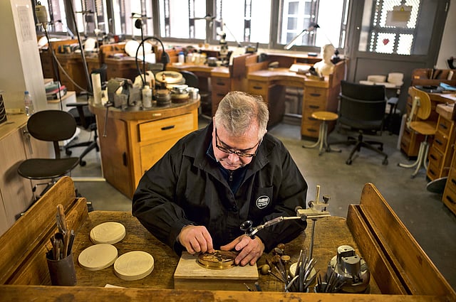 A worker working in the coin minting workshop