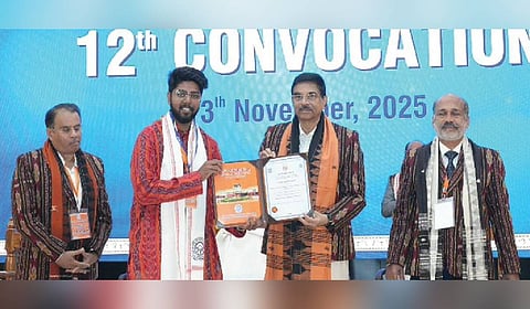 Governor Hari Babu Kambhampati presents certificate to a student at the event.