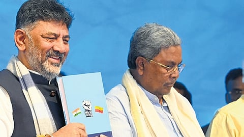 CM Siddramaiah and Deputy CM DK Shivakumar at the book launch event in Bengaluru on Friday.