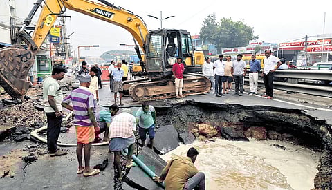 A huge crater was formed on Sathyamangalam Road in Coimbatore after the road caved in. An earthmover fell inside the crater on Thursday night.