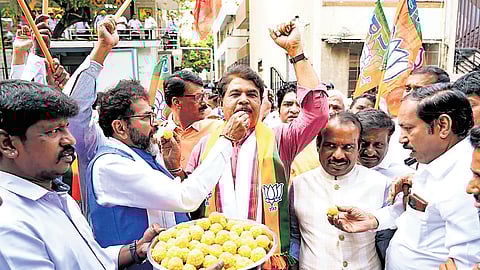BJP leaders — LoP in Assembly R Ashoka and LoP in Council Chalavadi Narayanaswamy — and workers celebrate the NDA’s victory in Bihar Assembly elections outside the party’s state office ‘Jagannath Bhavan’ in Bengaluru on Friday.