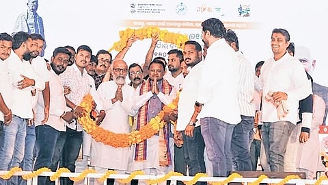 CM Mohan Charan Majhi and other guests being garlanded at the event.