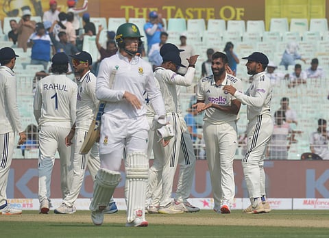 India's Jasprit Bumrah (2nd from right) celebrates a wicket with teammates against South Africa on Day 1 of the first Test in Kolkata on Friday