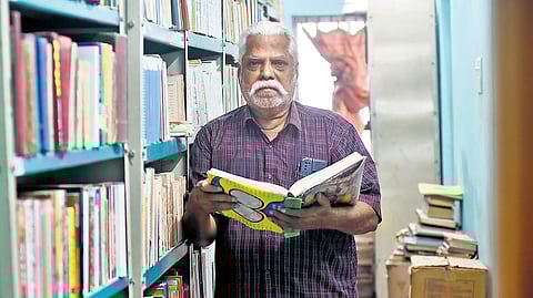 Pazhankaasu Srinivasan in his home library, which houses over 50,000 books, at Kovilpathagai in Tiruvallur.