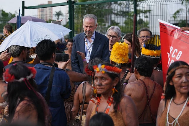 André Corrêa do Lago, COP30 president, speaks with an Indigenous group blocking an entrance to the COP30 U.N. Climate Summit, Friday, Nov. 14, 2025, in Belem, Brazil. 