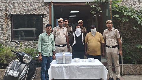 A total of Rs 50,000 in cash, three ATM cards, a scooter, and a mobile phone were recovered.