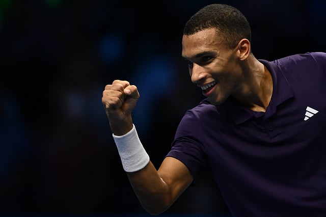 Canada's Felix Auger Aliassime celebrates after winning his men's single match against Germany's Alexander Zvrev at the ATP Finals tennis tournament, in Turin, on November 14, 2025.