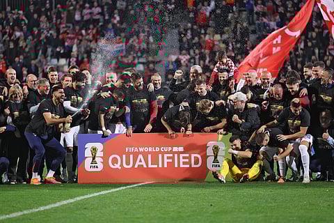 Croatian players, officials and their relatives celebrate their team's qualification for the World Cup at the end of the 2026 World Cup qualifiers Europe zone group L football match between Croatia and Faroe Islands at the Stadion HNK in Rijeka, on November 14, 2025.