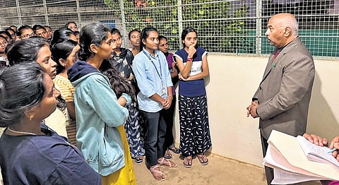 Hostlers narrate their woes to Upa Lokayukta Justice KN Phaneendra at Dr BR Ambedkar Government Post-Matric Girls’ Hostel near Manuvana in Vijayanagar, Bengaluru | Express
