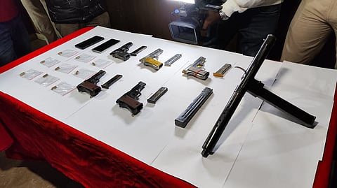 Police seize carbine from 2 Bihar natives.