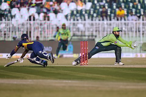 Pakistan's Haseebullah Khan, right, attempts to run out to Sri Lanka's Kusal Mendis, left, during the third one day international cricket match between Pakistan and Sri Lanka, in Rawalpindi, Pakistan, Sunday, Nov. 16, 2025.