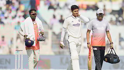 Shubman Gill, center, leaves the field after retired hurt on the second day of the first cricket test match between India and South Africa in Kolkata, India, Saturday, Nov. 15, 2025. 