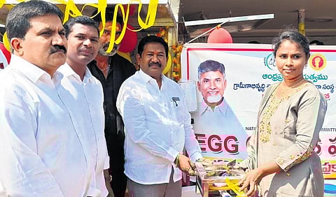 Social Welfare Minister Dr Dola Sree Bala Veeranjaneya Swamy distributing the egg carts to beneficiaries at the Turpu Naidupalem camp office on Sunday.