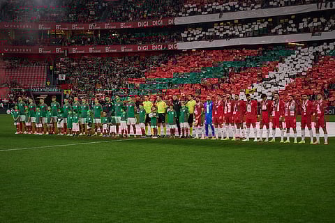 Palestinian players and Spanish players from the Basque Country line up ahead of a friendly match, held to protest Israel's military actions in Gaza, in Bilbao, Spain, Saturday, Nov. 15, 2025.