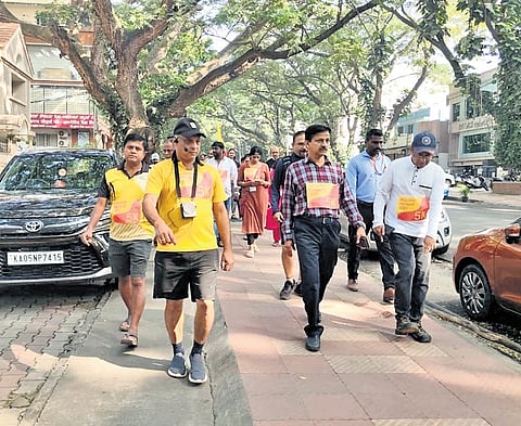 Bengaluru South City Corporation Commissioner Ramesh KN, along with officials, inspects a footpath in Jayanagar on Sunday | Express