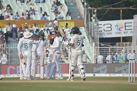 South Africa players celebrate their win over India in the first Test at Kolkata on Sunday.