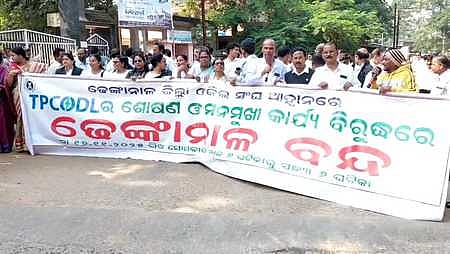 Agitators taking out the protest march in Dhenkanal town on Monday