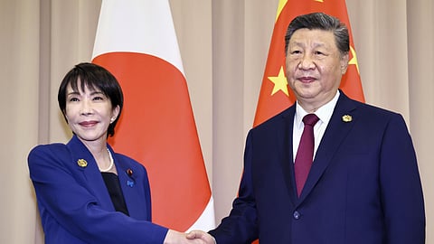 Chinese President Xi Jinping, right, shakes hands with Japanese Prime Minister Sanae Takaichi ahead of their meeting in Gyeongju, South Korea, Oct. 31, 2025.