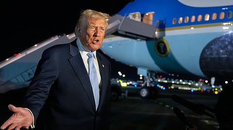 President Donald Trump speaks to reporters before boarding Air Force One at Palm Beach International Airport in West Palm Beach Fla., on his way back to the White House, Sunday, Nov. 16, 2025.