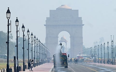 An anti-smog gun spraying water to curb air pollution amid heavy smog conditions at Kartavya Pathin New Delhi.