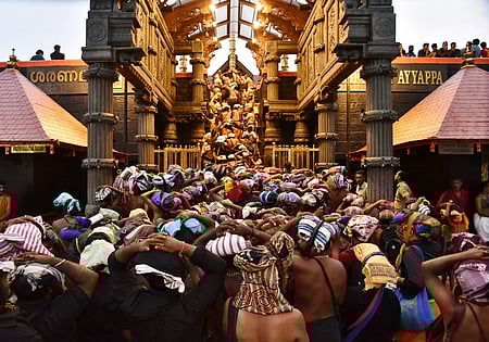 Heavy rush of devotees seen waiting in queue in front of the Holy Steps for darshan when Sabarimala temple was opened for the Mandala-Makaravilakku